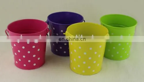 small colorful metal pail with handle