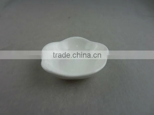 white porcelain flower-shaped dish