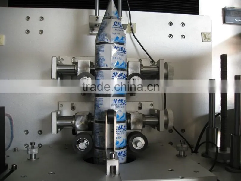 Automatic bottle label shrinking machine