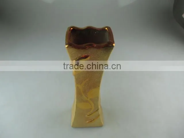 beautiul golden porcelain type vase with flower design