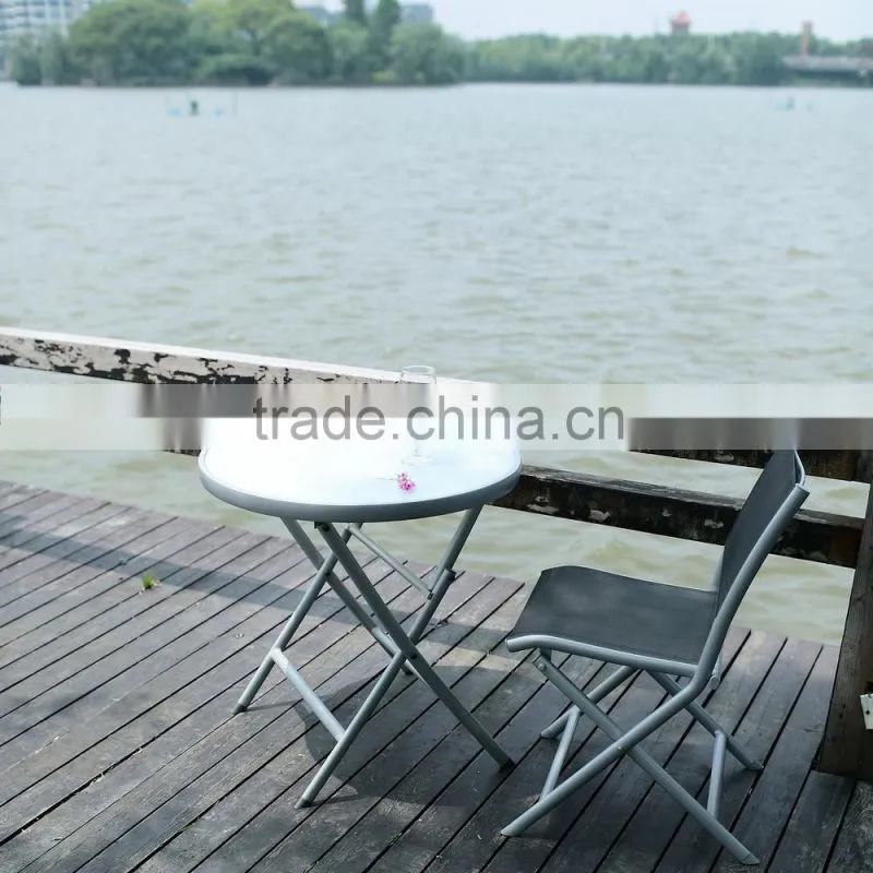 Metal folding table with silk screen printed stalinite top