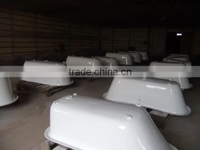 rectangular freestanding cast iron bathtub with wooden cradle