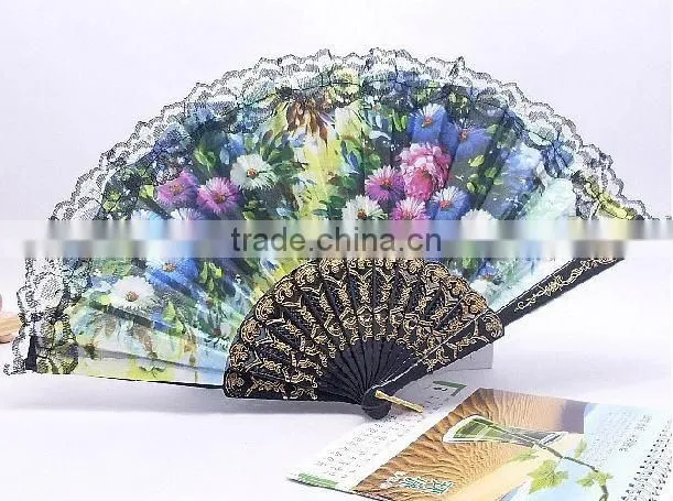 Spanish style plastic folding fan with flower