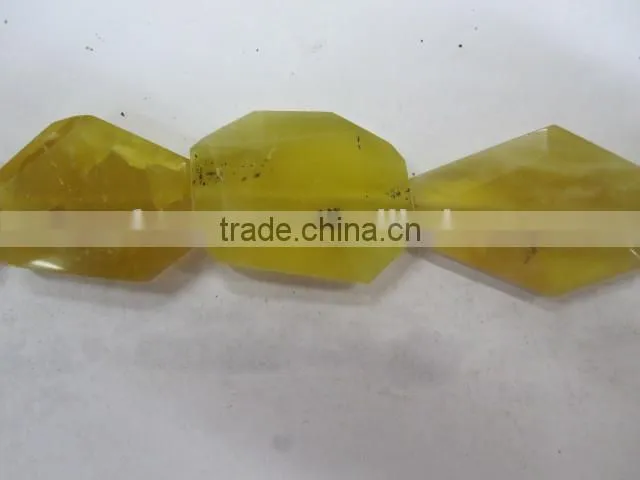 Wholesale yellow opal Tumbled flat loosen faceted gemstone manufacturer
