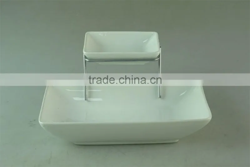 stocked white ceramic rectangle French fries serving plate with dipping dish and iron stand