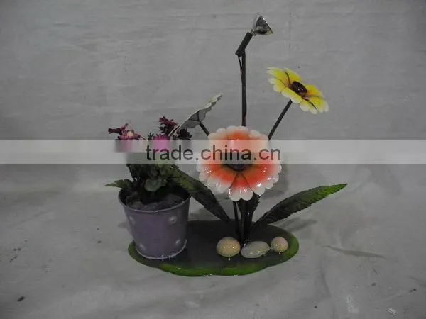 Colorful metal flowers planter with bicycle