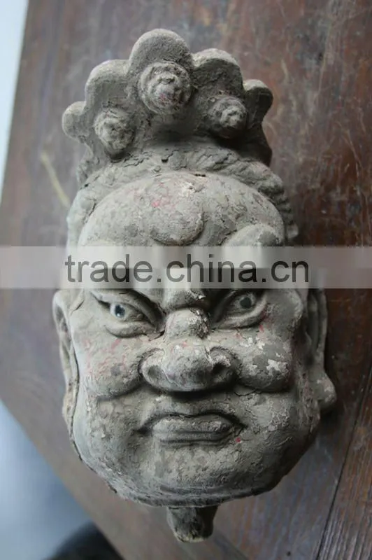 hand carved mud buddha head