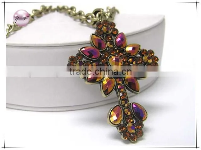 Crystal and metallic stone deco cross pendant necklace