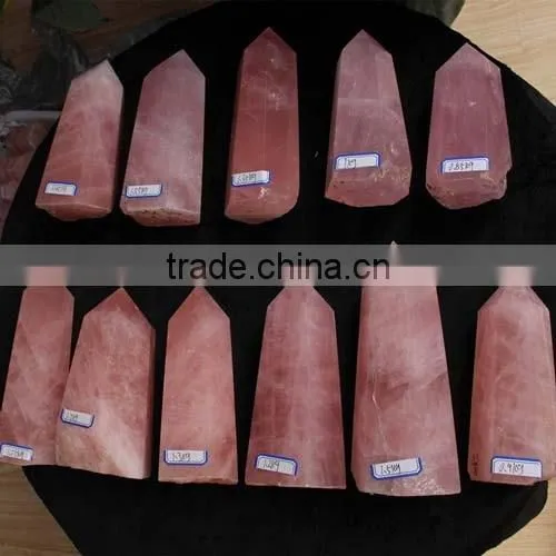 bulk of natural rock polished rose quartz stone crystal tower