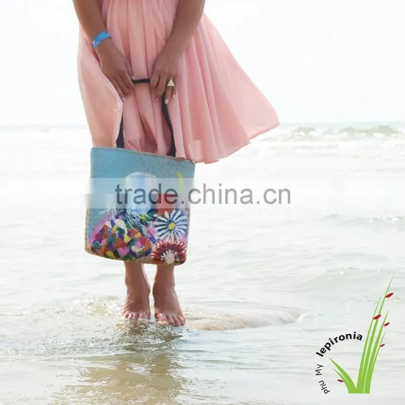 Seagrass beach bag with seashell decoration, cool design for summer holiday
