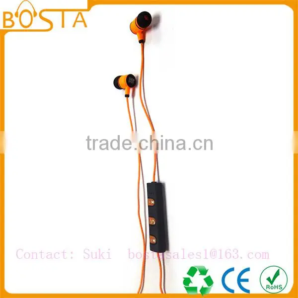 Sports sweat-proof wholesale shiny orange soft ruberized string bluetooth earphones