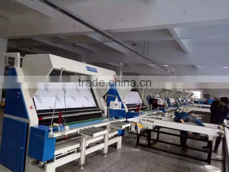 VERTICAL FABRIC-CUTTING MACHINE