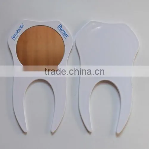 Cheap plastic wholesale one side tooth shaped hand mirror