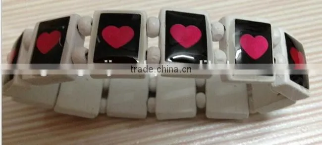 Wood bracelet with epoxy logo sticker