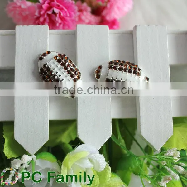Latest design various custom rugby shape crystal rhinestone buttons