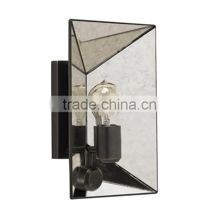 12.14-1 Faceted Mirror panels and an antique-bronze finish Sconce Make it shine a retro-glamorous feel