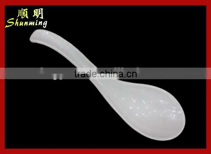 White plastic serving spoon