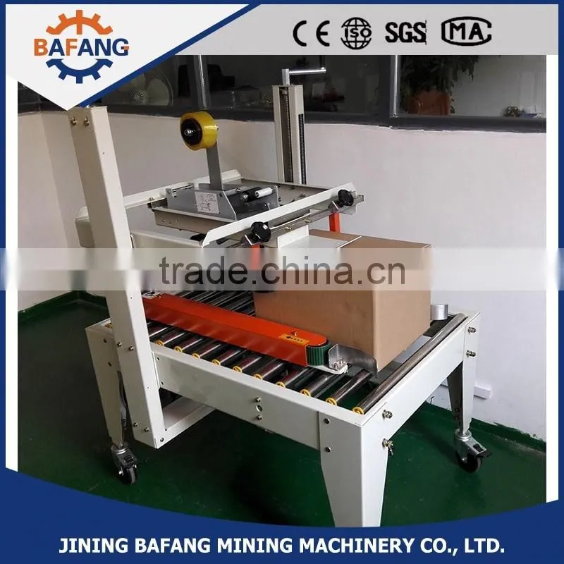 Semi-auto boxes sealing strapping machine