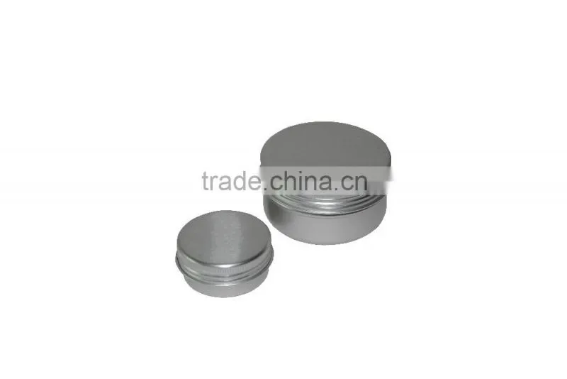 Small round tin box with clear window and screw