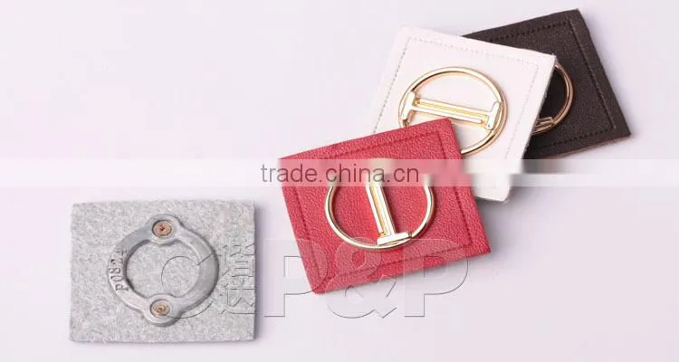 Delicate metal label branded leather patch in garment