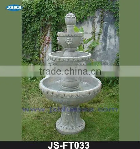 White marble wall fountain with angel