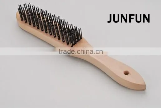 different rows wooden handle black steel wire brush