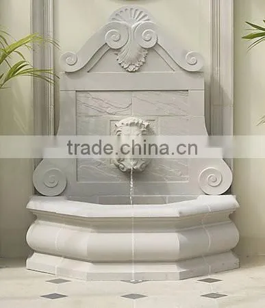 Marble lion head wall fountain