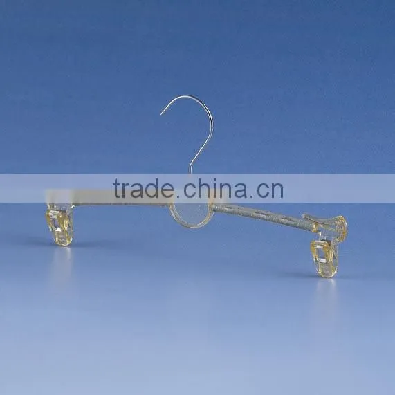 Gold metal hanger with clips for bikini clothes