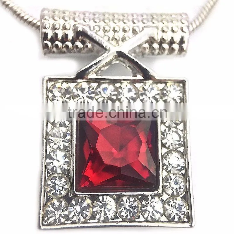 large red crystal surrounded by clear microset crystals necklace and earring