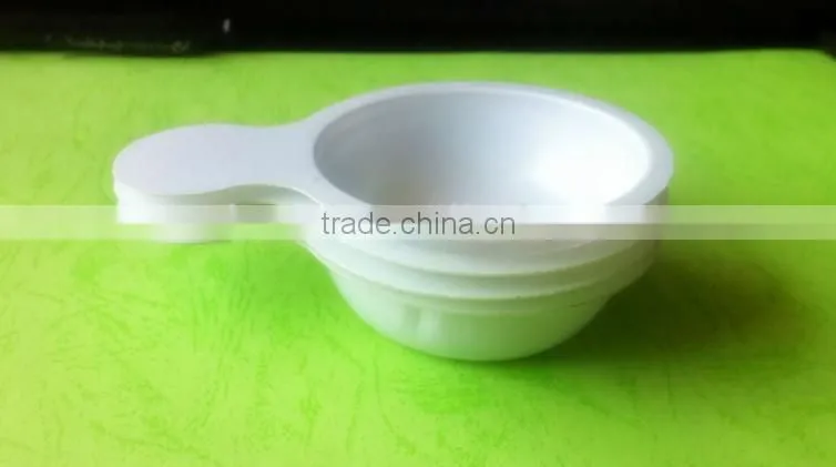 white disposable plastic tray for urine testing.