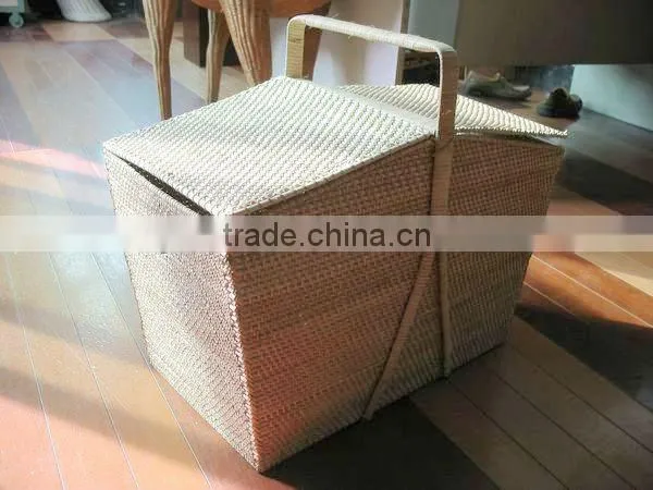 Empty wicker gift basket with lid and handle