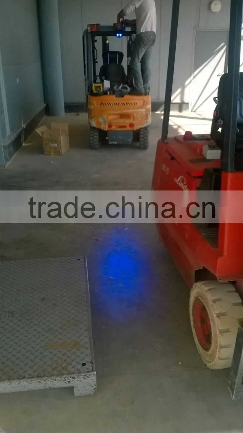 Forklift approaching blue warning light