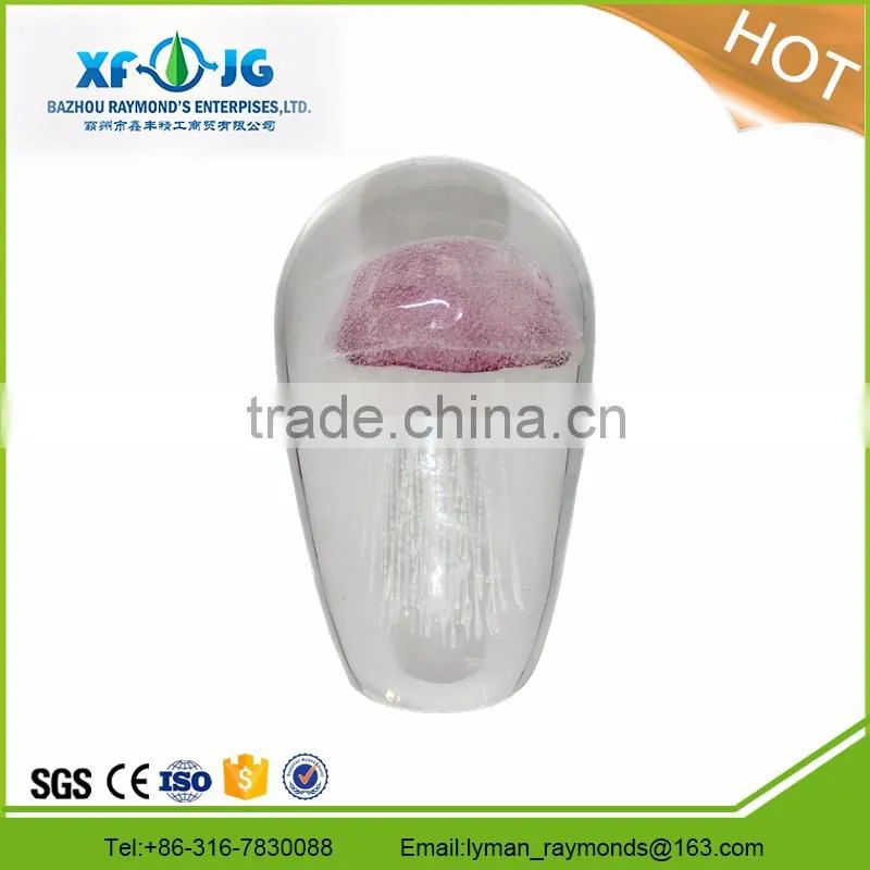 Clear dome glass paperweights with red jellyfish
