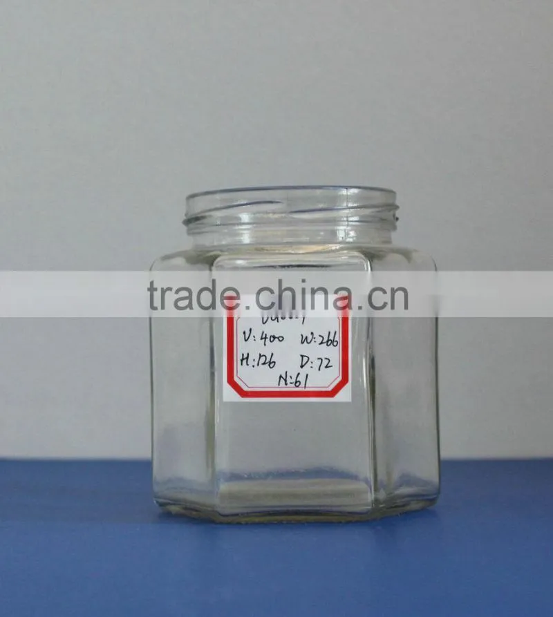 Empty glass hexagon jar for sauce