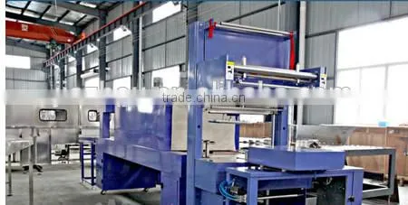 Professional full automatic film shrinking wrapping packing machine for PET bottle