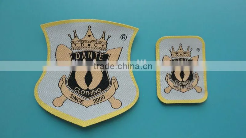 High Quality Black Black Background White Logo Merrow Border Woven Label