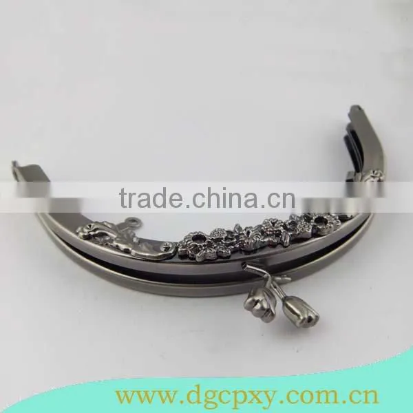 gunmetal round shape frame with flower carved pattern and flower kiss lock