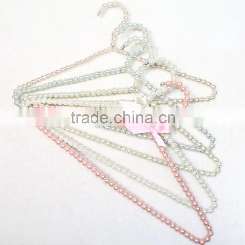 New design cheap brass pearl clothes hanger