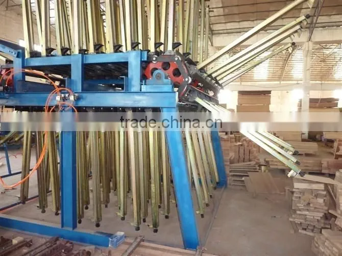 Pneumatic wood composer rotary clamp carrier for wood