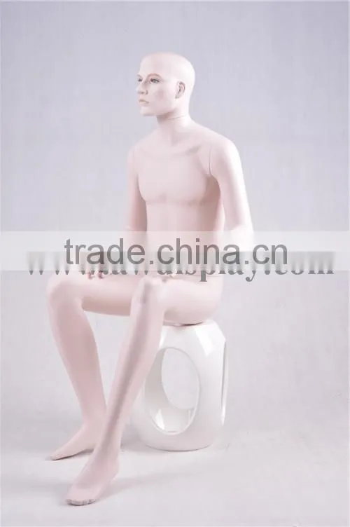 Realistic male mannequins in sitting pose