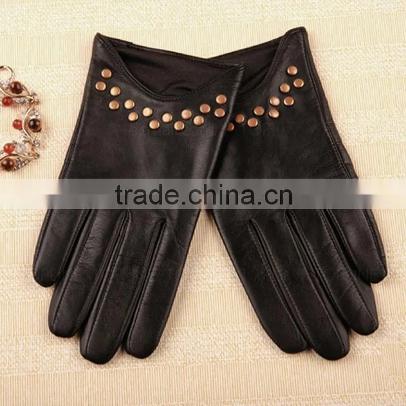 women wearing black and wet blue fashion leather driving gloves