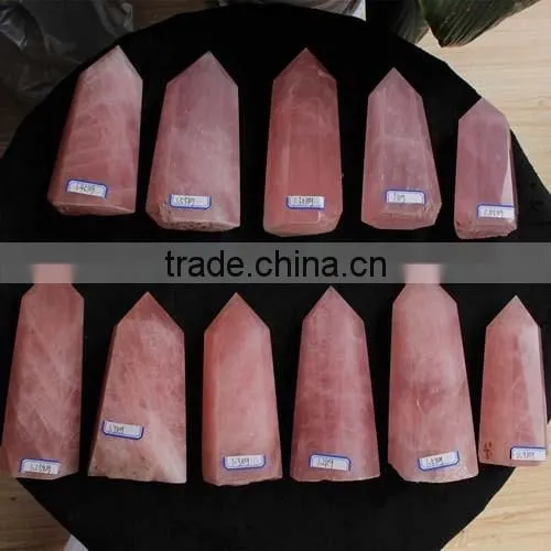 bulk of natural rock polished rose quartz stone crystal tower