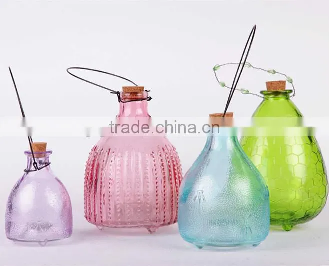colorful glass fly trap with hanging wire
