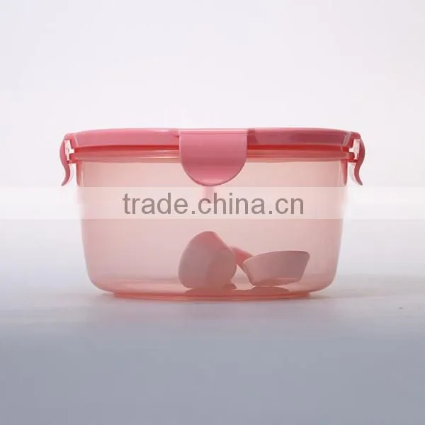 Household pink round four locked lunch box with spoon