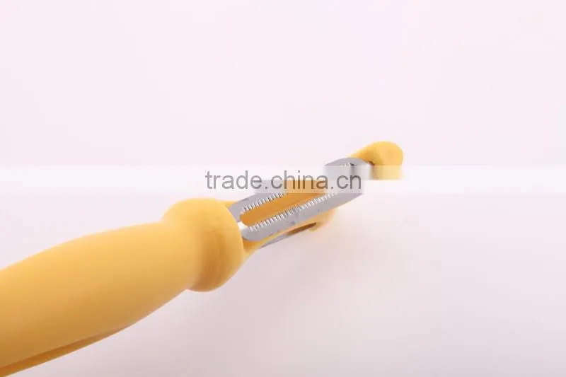 double blade plastic serrated orange vegetable peeler