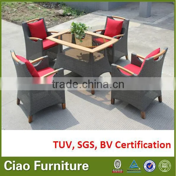 Teak wood with insert black glass top, rattan base outdoor table