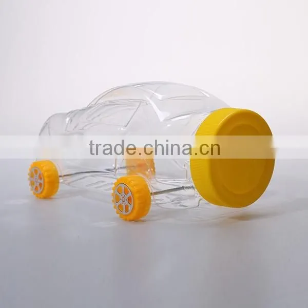 Small cute clear plastic bottles in toy shaped for candy