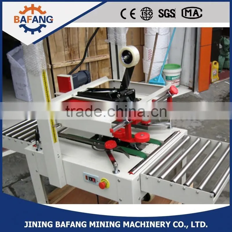 Semi-auto boxes sealing strapping machine