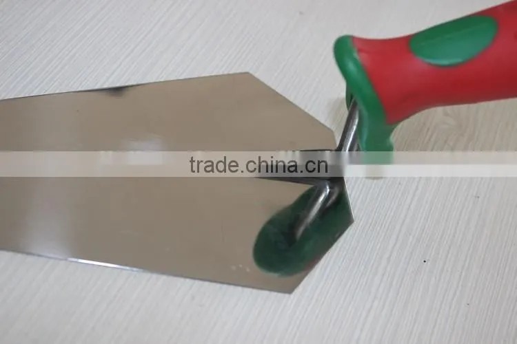 Bricklaying trowel with rubber hand