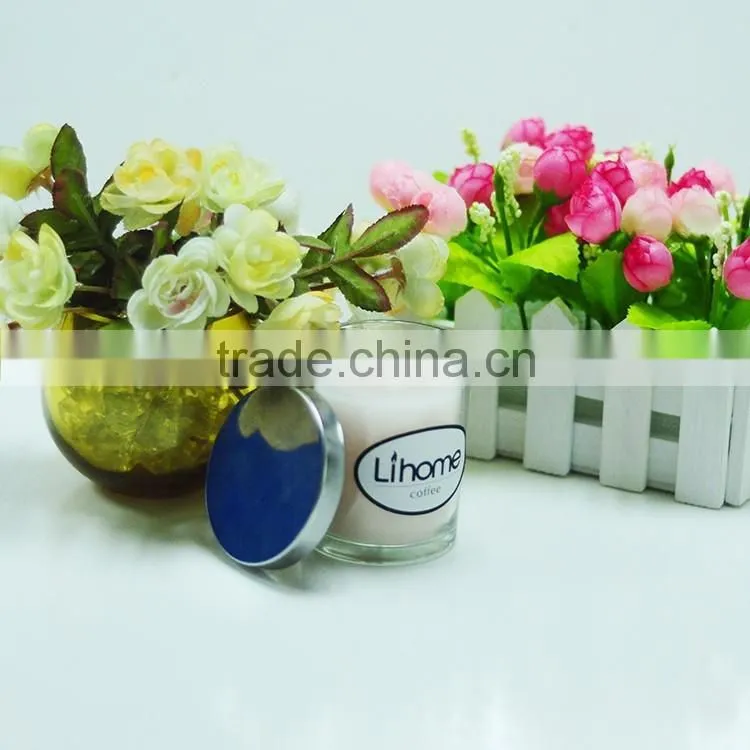 Scented candle in glass jar with metal lid